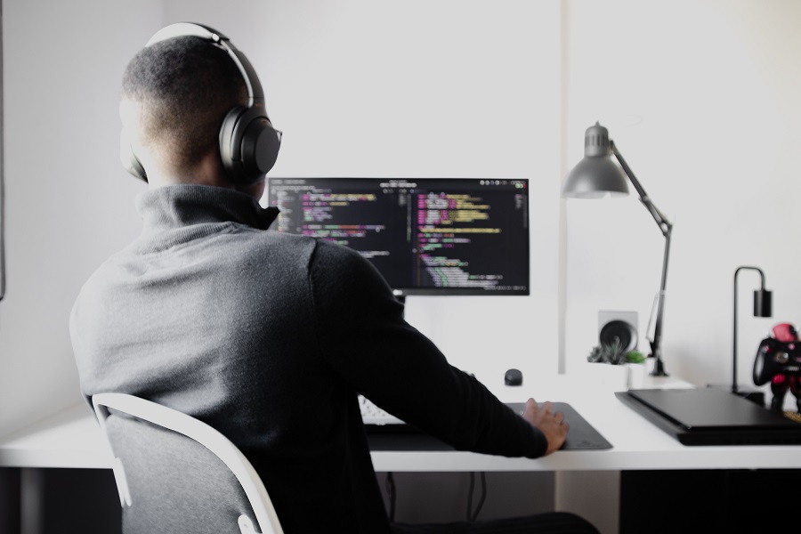 Developer Interest, shadowy super-coder in front of a computer